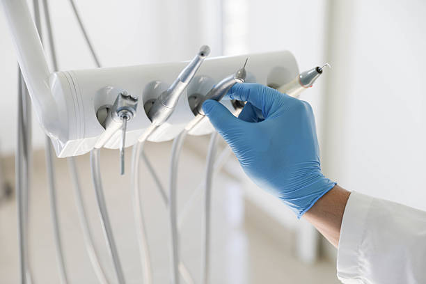 Professional Tooth Extraction technician working in Farmville, NC